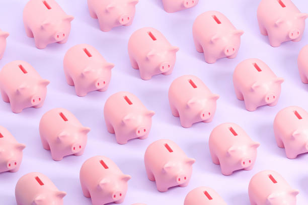 istock Piggy banks in row top view pattern on purple background 1736736052