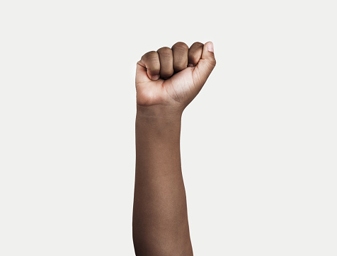 Isolated image of a boy with fist up on a white background