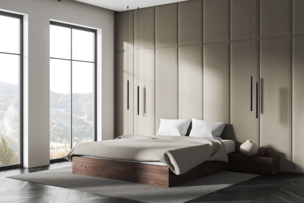 istock Cozy hotel bedroom interior with bed and nightstand, panoramic window 1736745289