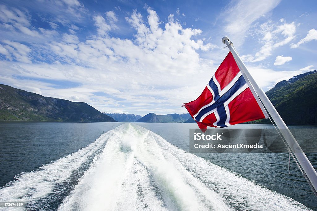 Fjords of Norway Norwegian flag on the back of a ferry cruising the fjords Norwegian Flag Stock Photo