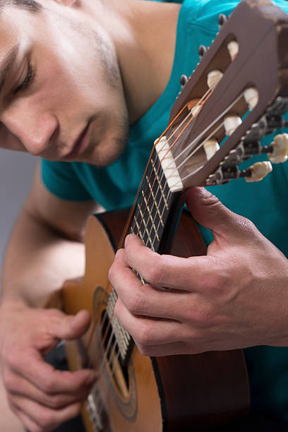 Young Man Playing Guitar stock photo