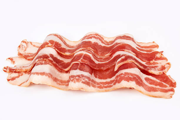 pork bacon Slices of smoked bacon close up uncooked bacon stock pictures, royalty-free photos & images