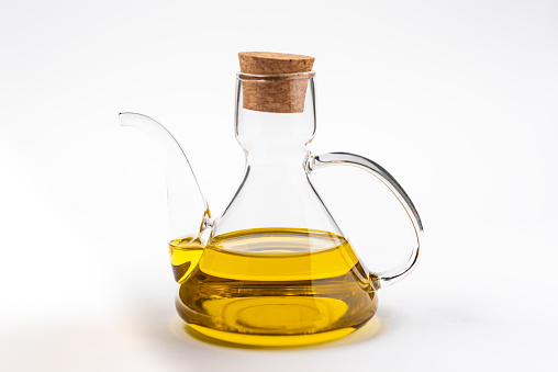 Typical oil jug with gold-colored virgin olive oil.