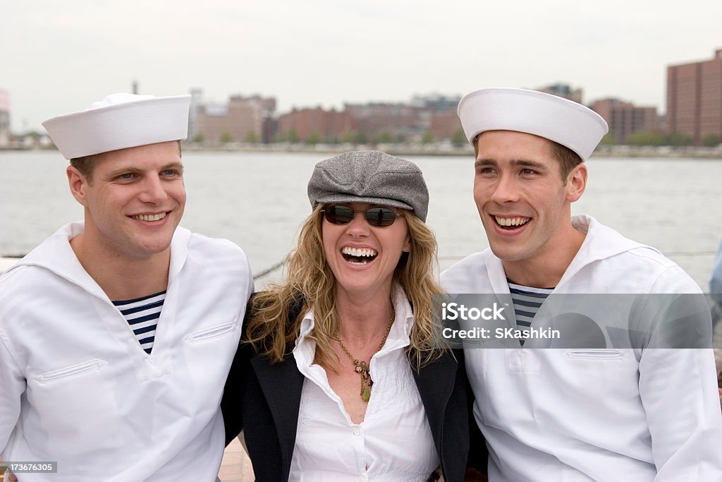 Good Time Female Model enjoying sailors company. Adult Stock Photo