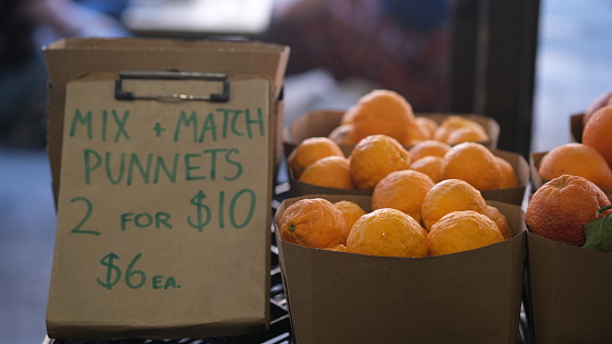 Punnet box of Sumerina mandarin citrus for sale at farmer market.