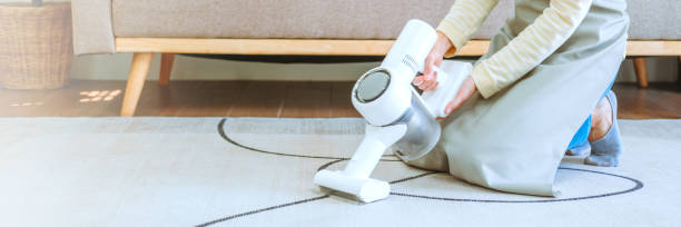 istock Asian woman using vacuum machine cleaning the floor. housekeeping concept 1736779902