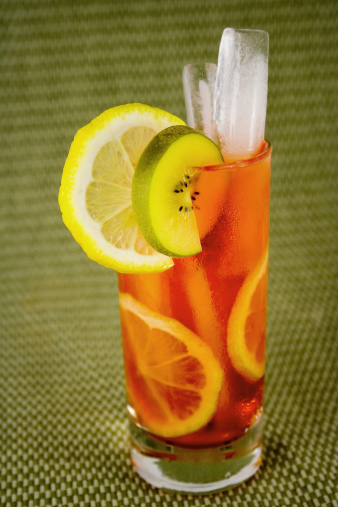 Tequila sunrise cocktail on wooden table. Close up