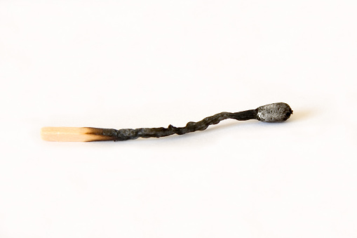 Fire of a match. Macro shooting, close-up. The fading of the match. Charred wood, smoke. High quality photo
