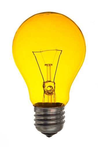 Yellow light bulb on white background.