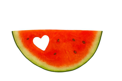 Piece of watermelon with a heart-shaped hole , white background