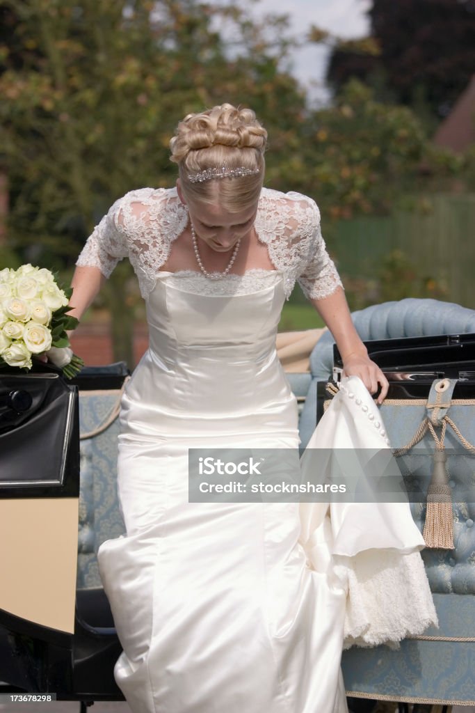 The Bride Arrives The bride arrives at the church in her horse-drawn carriage Bride Stock Photo