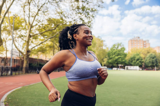 istock Woman running in a running track 1736788052