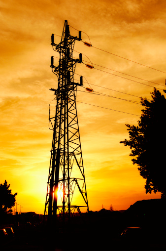 High voltage tower in a sunset.