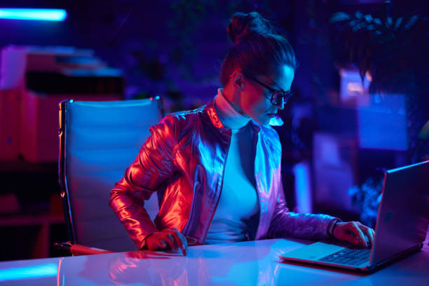 istock modern female in glasses using laptop in modern office 1736796906