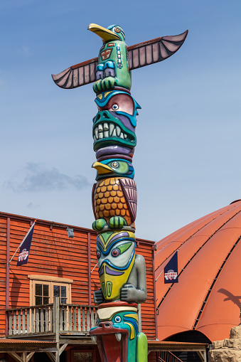 Slagharen, the Netherlands, 27 April 2023. Indian totem pole, hand-carved and hand-painted, in Slagharen attraction park.