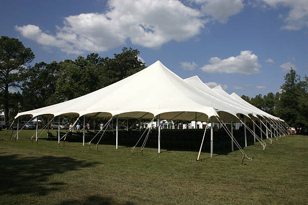 Large tent set up on the lawns for banquet Large Canvas Tent for an outdoor church service revival stock pictures, royalty-free photos & images