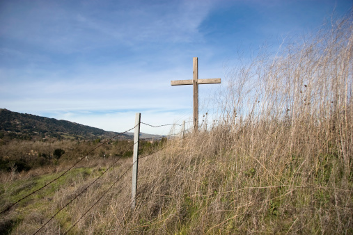 A Christian cross placed at the side of a California Highway.