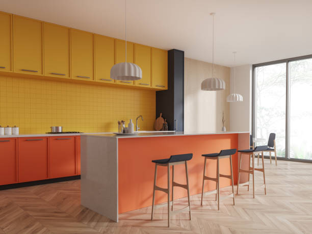 istock Colorful hotel kitchen interior with bar counter and dining corner near window 1736821808