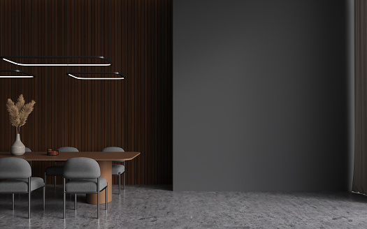 Dark dining room interior with table and chairs in row, grey concrete floor. Stylish meeting or living room with mockup copy space empty wall. 3D rendering