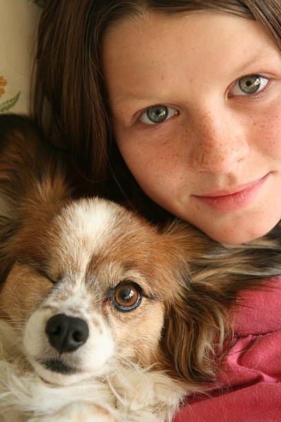 ten year old girl with one eyed Papillon