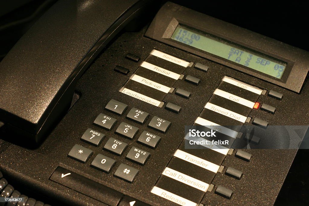 Office Telephone - Closer A closer view of an office telephone with many functions. Office Stock Photo