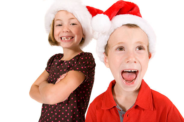 istock Brother and sister in Santa hats 173683268