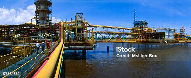 Off Shore Oil Industry With Some Engineers Stock Photo - Download Image Now - Offshore Platform, Environmental Damage, Equipment