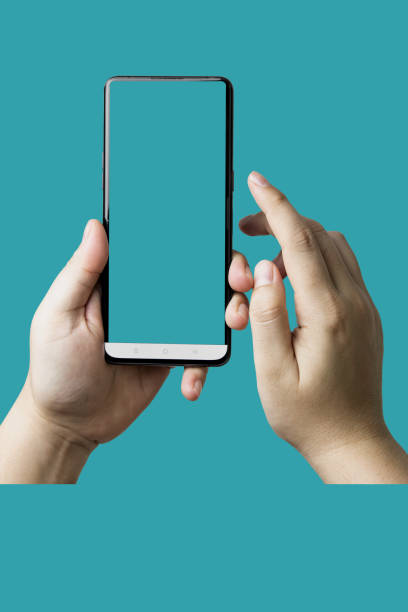 istock Male hands touching screen mobile phone a vertical smartphone with blank screen isolated on background. 1736853750