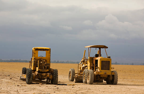 Two old roadwork vehicles ready to start roadwork on the drysavannah before the rain comes.See also my LB: