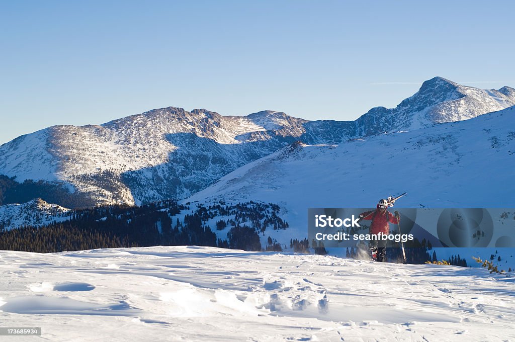 Skier Hiking Skier hiking in front of the Sawatch Range Colorado with copy-space. Adult Stock Photo