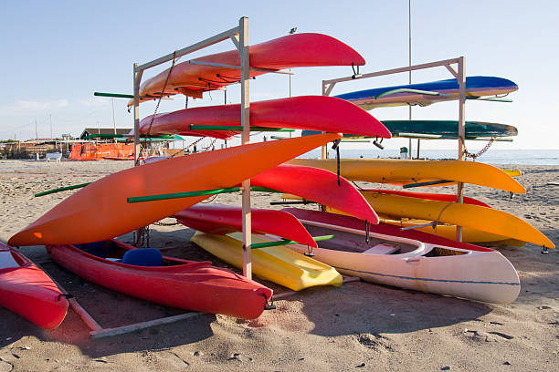 istock colorful canoes on the beach 173686254