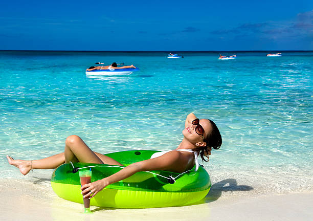 istock happy woman relaxing with cocktail 173686488