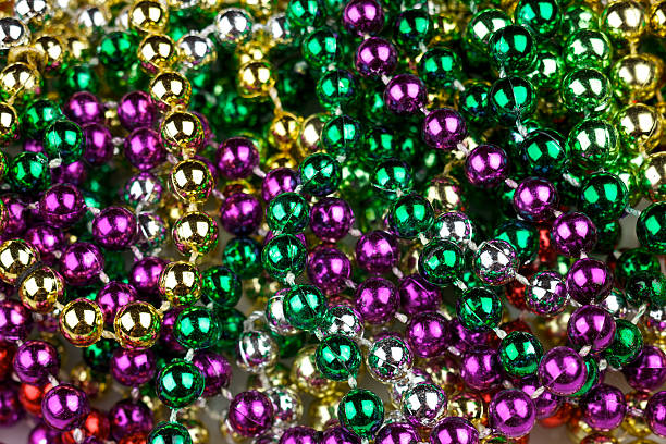 istock Mardi Gras beads in traditional colors 173686701