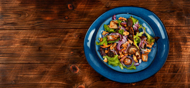 istock Mushroom salad with onions and walnuts. 1736882487