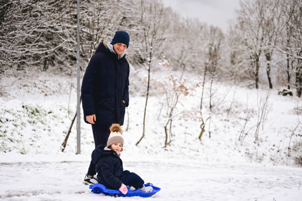 istock young family in a snowy forest. 1736898163
