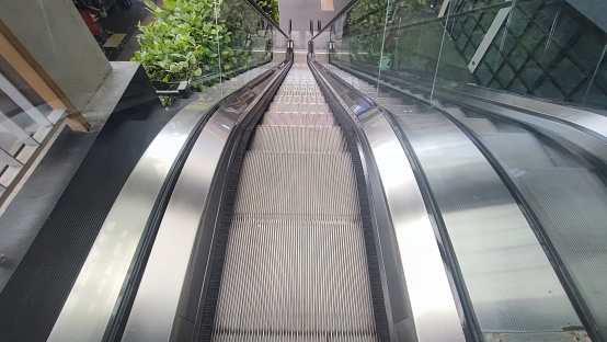 Mechanical escalators for people up and down, access detail