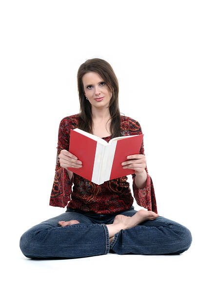 istock woman reading  book  in a yoga pose 173690098