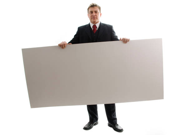 Businessman holding blank card