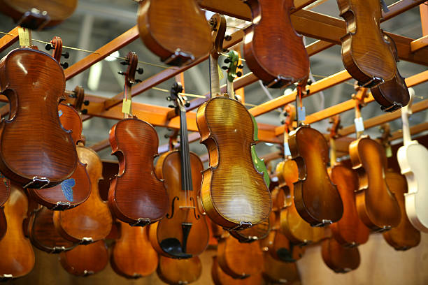 Violins hanging down from the ceiling