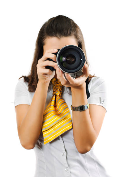 istock Young woman with SLR camera 173692155