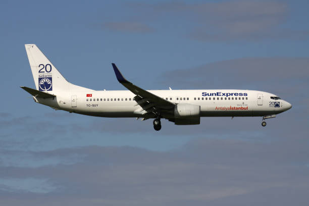 SunExpress Boeing 737-800 Oberglatt, Switzerland - June 25, 2011: Turkish SunExpress Boeing 737-800 (with 20 Years stickers) with registration TC-SUY on short final for runway 14 of Zurich Airport. sunexpress stock pictures, royalty-free photos & images