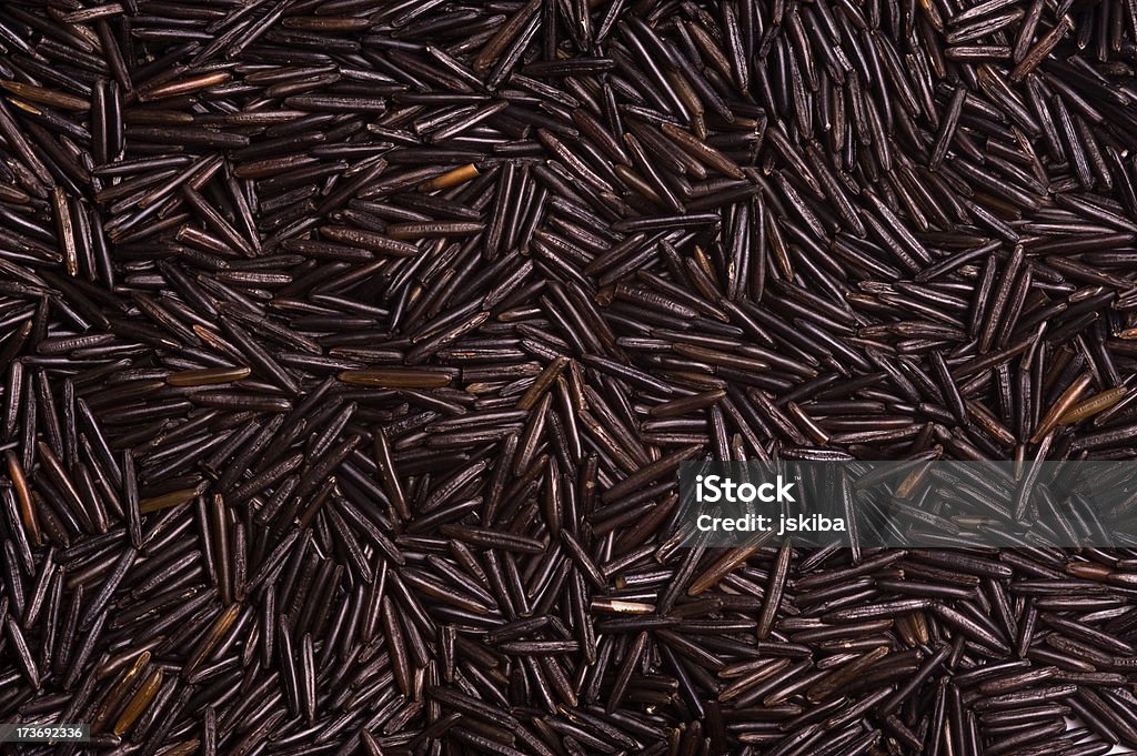 Organic black wild rice background Organic black wild rice intended to be used as a food backgroundHorizontal composition Backgrounds Stock Photo