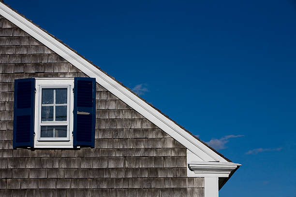 istock house with blue shutters 173692620