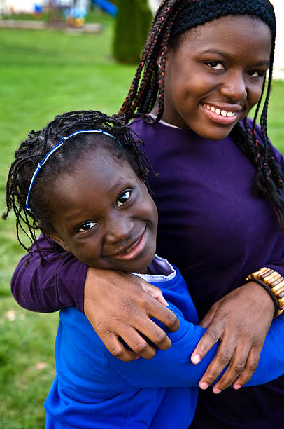 istock Two Happy Girls Smiling and Hugging Each Other 173693141