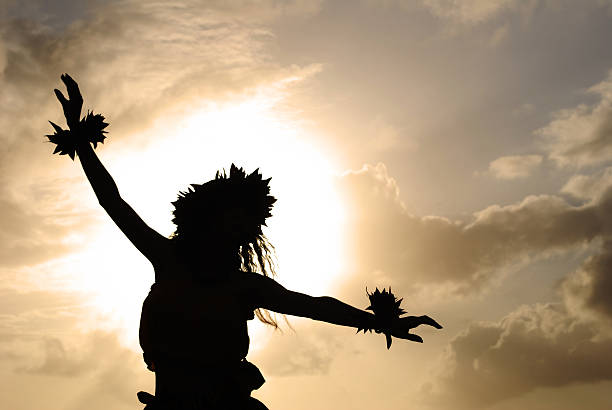 Hula Dancer Silhouette Hula dancer silhouetted at sunset. hula dancing stock pictures, royalty-free photos & images