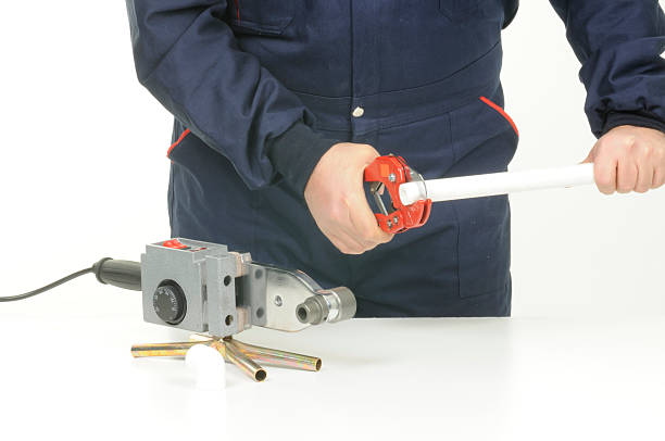 istock Plumber Cutting PVC Tube 173694006