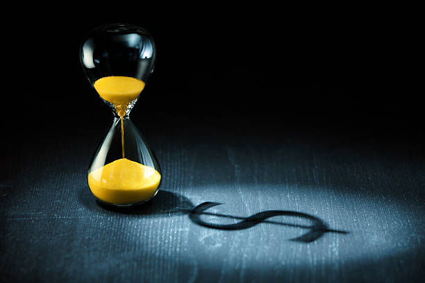 Hourglass And Dollar Shadow Stock Photo - Download Image Now - Hourglass, Currency, Time - iStock Hourglass And Dollar Shadow Stock Photo - Download Image Now - Hourglass, Currency, Time - iStock