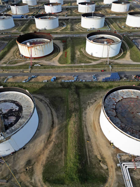 istock Multiple white oil storage tanks in the line aerial view 1736953634