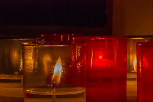 Birgufest candlelight: atmospheric celebration with flickering flame in old glass.