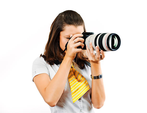 istock Young woman with SLR camera 173695621